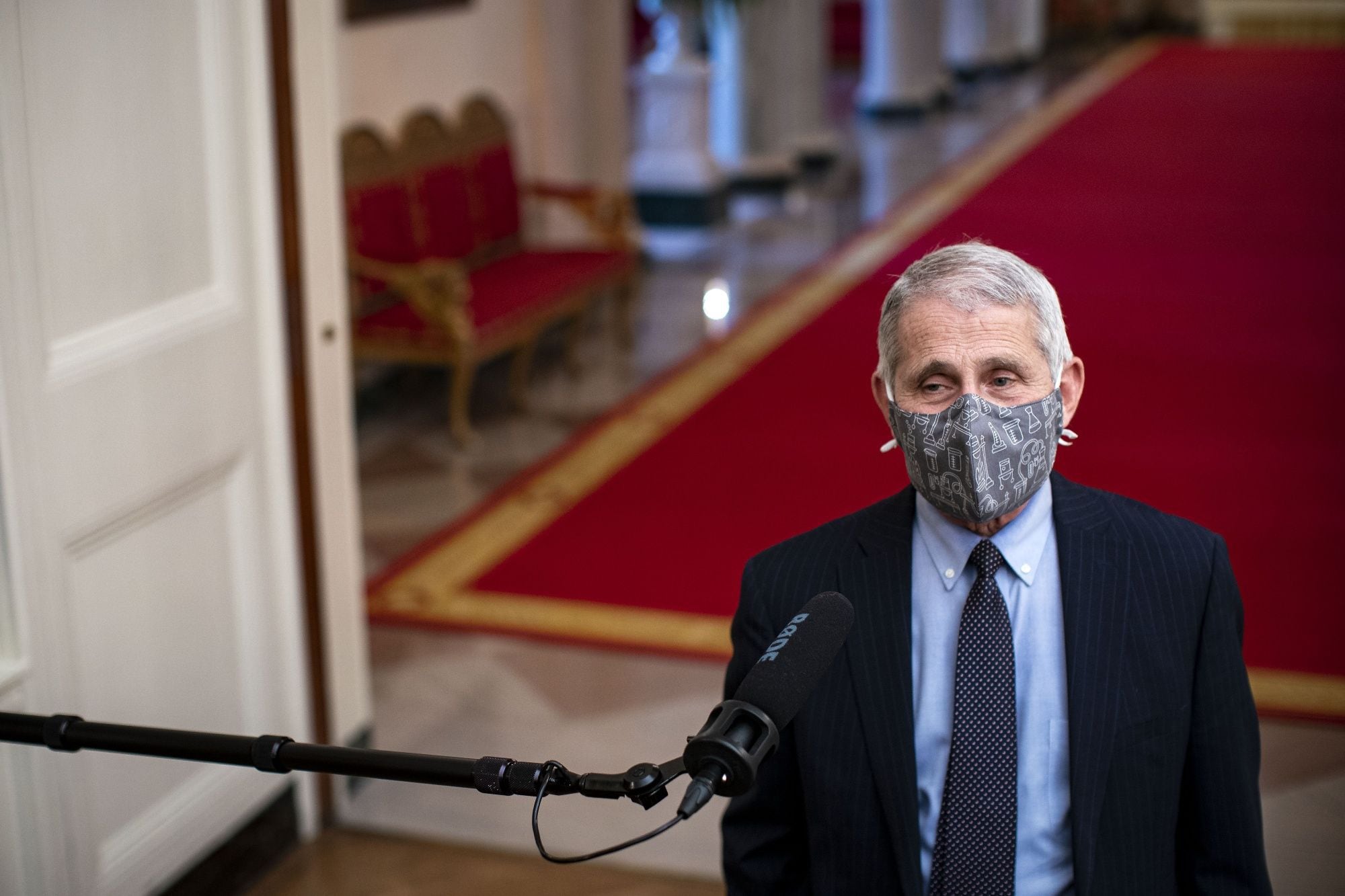 Anthony Fauci, director of the National Institute of Allergy and Infectious Diseases, wears a protective mask while speaking to members of the media before an event on the Biden administration's Covid-19 response in the State Dining Room of the White House in Washington, D.C., U.S., on Thursday, Jan. 21, 2021. Joe Biden in his first full day in office plans to issue a sweeping set of executive orders to tackle the raging Covid-19 pandemic that will rapidly reverse or refashion many of his predecessor's most heavily criticized policies.
