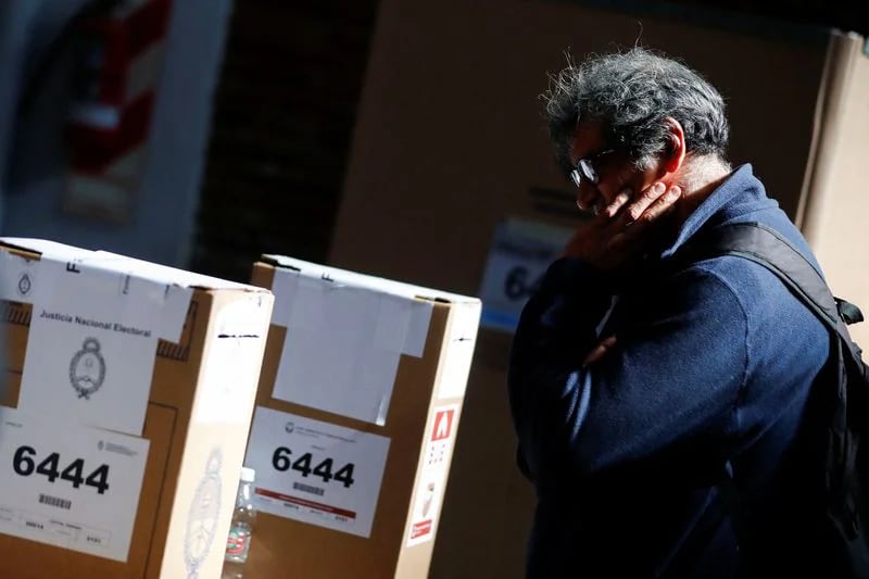 File photo: A person stands in front of a voting station in the primary elections in Buenos Aires, Argentina.  Aug 13, 2023. REUTERS/Agustin Marcarian
