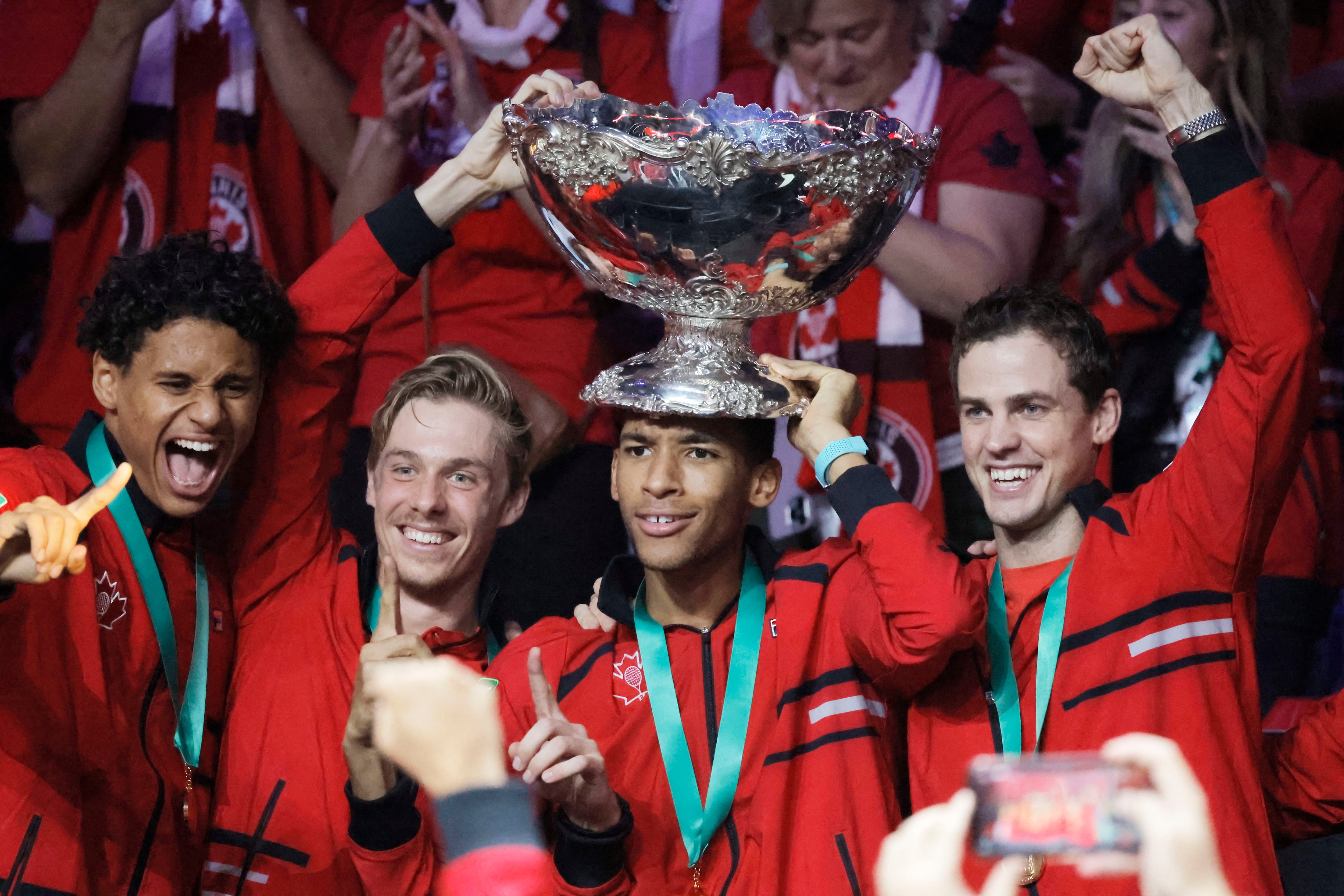 Canada's players, defending champions of 2022, celebrate after winning the first Davis Cup in their history.