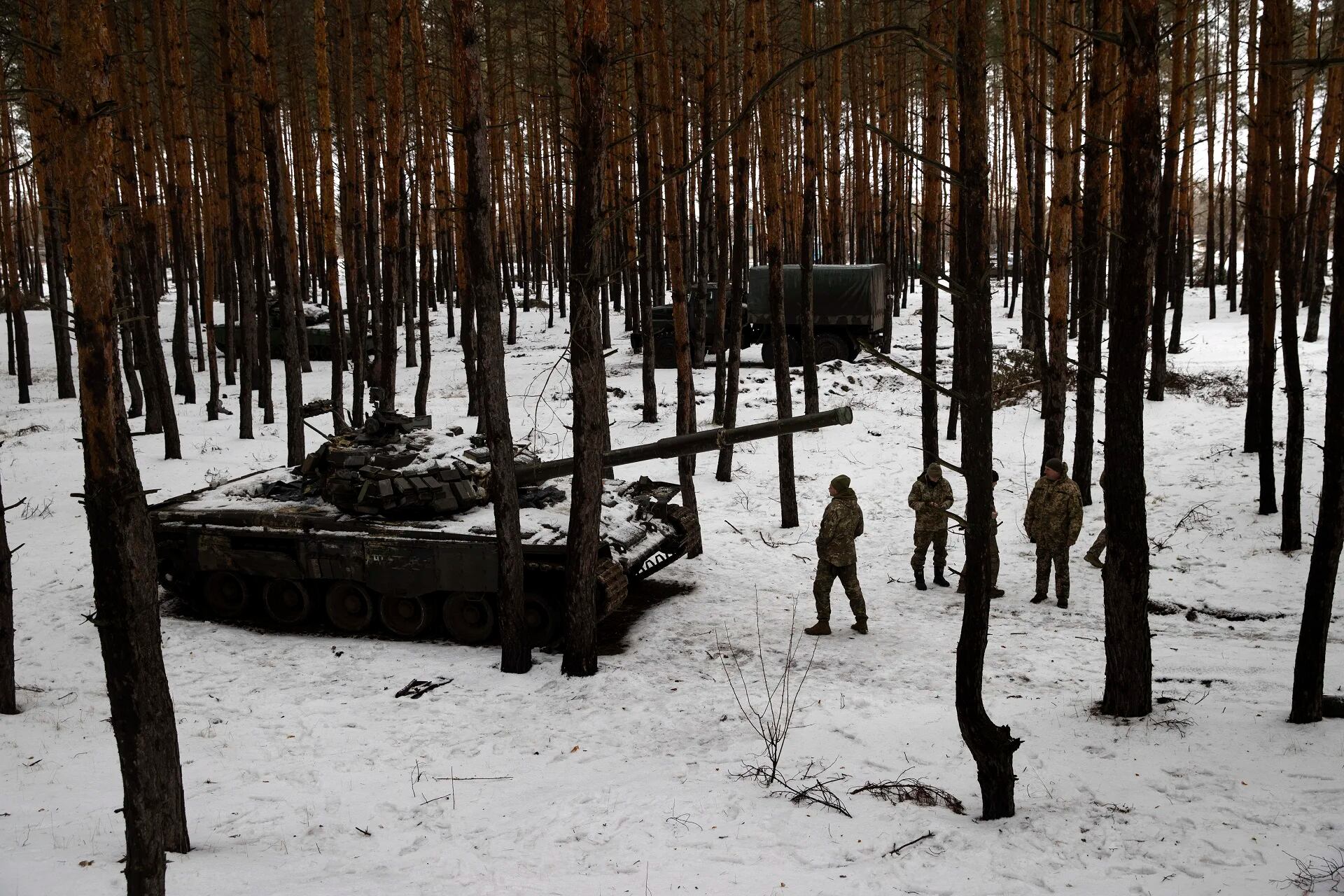 Members of a Ukrainian unit in a forest in eastern Ukraine, Feb. 21, 2023. In a lengthy address on Tuesday, President Vladimir Putin of Russia again falsely claimed that Western nations had “started the war” in Ukraine and showed no sign of ending an invasion that has failed to achieve many of Putin’s objectives after nearly a year of brutal fighting. (Tyler Hicks/The New York Times)