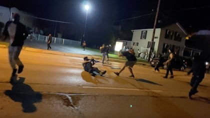 Men scuffle during a protest following the police shooting of Jacob Blake, a Black man, in Kenosha, Wisconsin, U.S., August 25, 2020, in this still image obtained from a social media video. Brendan Gutenschwager/via REUTERS THIS IMAGE HAS BEEN SUPPLIED BY A THIRD PARTY. MANDATORY CREDIT.