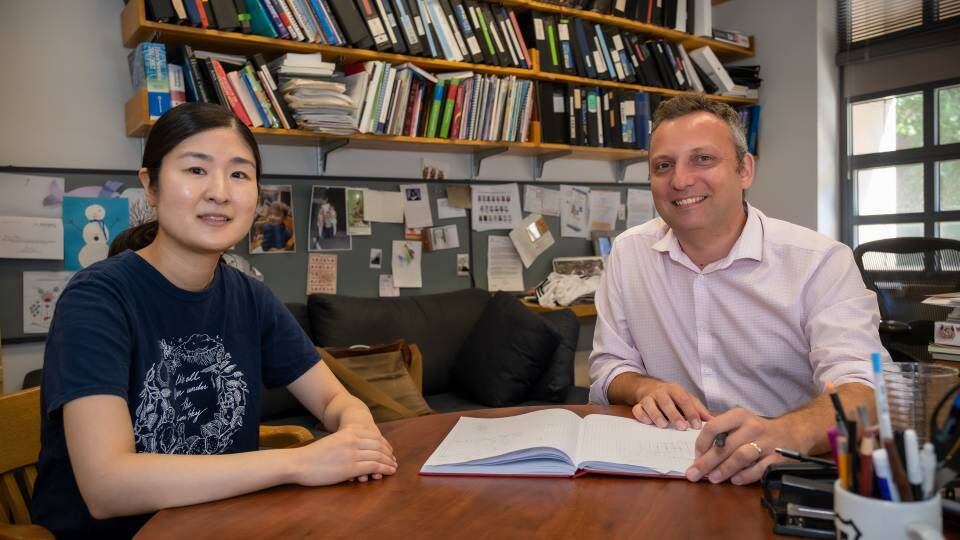 Saori Suzuki, a postdoc in the Ploss Lab and lead author on the JACS paper; and Alexander Ploss, professor of Molecular Biology.  Photo by C. Todd Reichart
