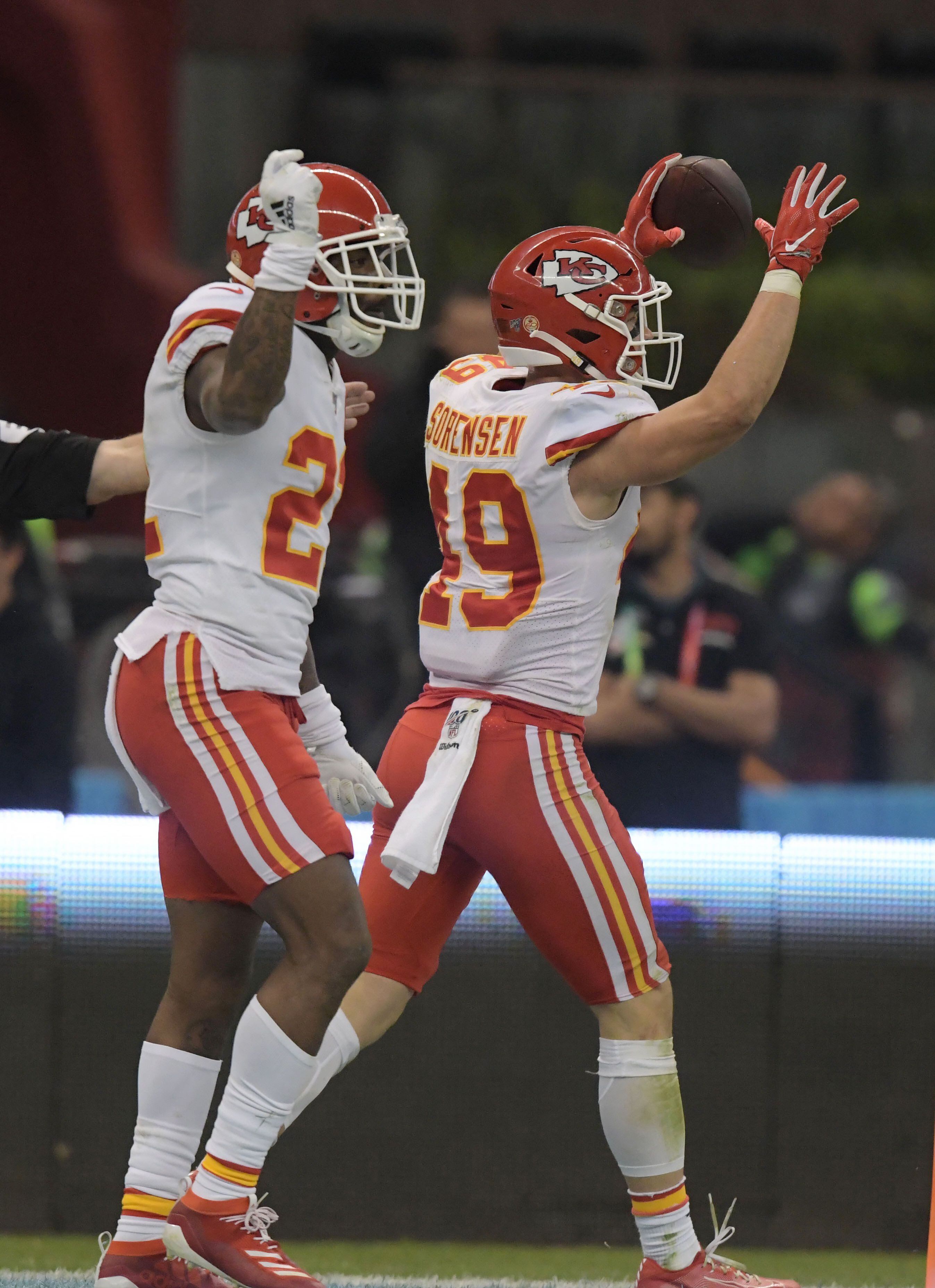 Nov 18, 2019; Mexico City, MEX; Kansas City Chiefs defensive back Daniel Sorensen (49) celebrates wtih free safety Juan Thornhill (22) after intercepting a pass in the final minute against the Los Angeles Chargers during an NFL International Series game at Estadio Azteca. The Chiefs defeated the Chargers 24-17. Mandatory Credit: Kirby Lee-USA TODAY Sports