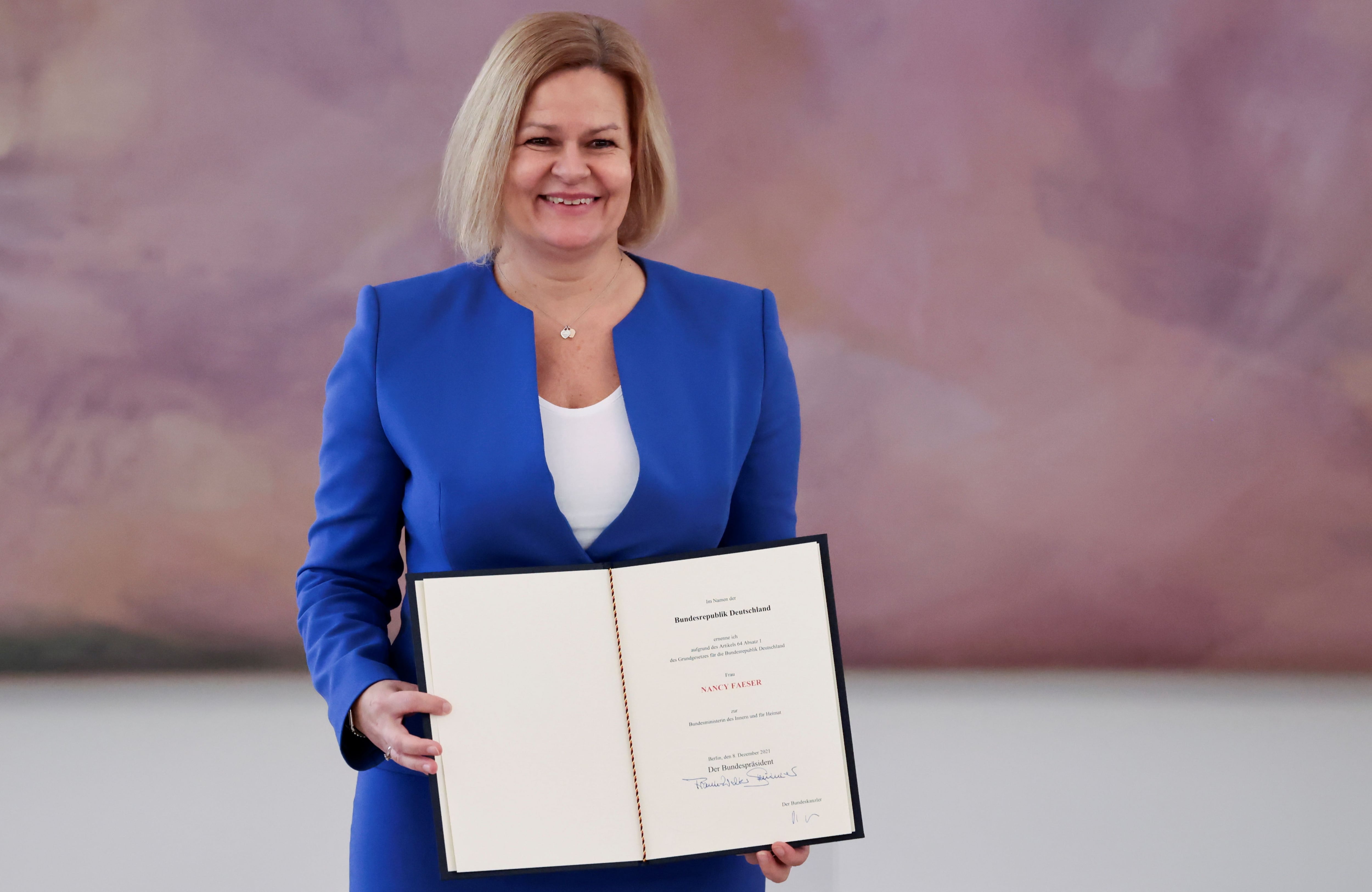 German Interior Minister Nancy Faeser poses after receiving her certificate of appointment from German President Frank-Walter Steinmeier during a ceremony at Bellevue Palace in Berlin, Germany, on December 8, 2021. REUTERS / Hannibal Hanschke