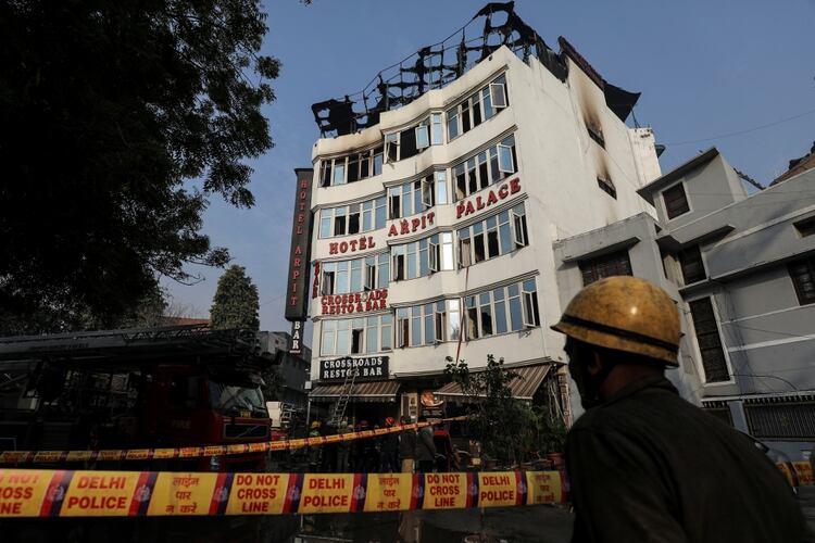A fireman stands outside the hotel where a fire broke out in New Delhi, India, February 12, 2019. REUTERS/Anushree Fadnavis