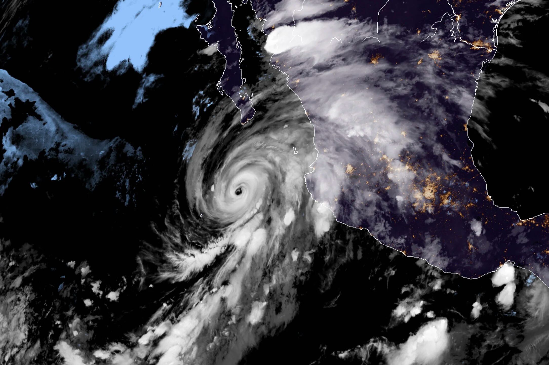 This RAMMB/NOAA satellite image obtained on August 18, 2020, shows Hurricane Genevieve moving towards Baja California on August 19, 2020 at 05:10:21 UTC. - Authorities in Mexico's Baja California closed ports and beaches on August 18 as Hurricane Genevieve barreled toward the peninsula packing winds of nearly 195 kilometers (120 miles) per hour. (Photo by - / RAMMB/NOAA/NESDIS / AFP) / RESTRICTED TO EDITORIAL USE - MANDATORY CREDIT "AFP PHOTO / RAMMB/NOAA" - NO MARKETING - NO ADVERTISING CAMPAIGNS - DISTRIBUTED AS A SERVICE TO CLIENTS