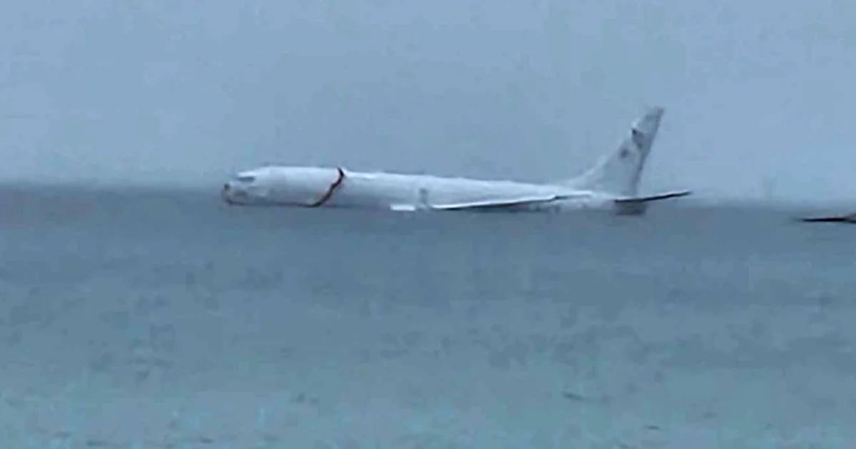 A US Navy plane with nine passengers on board skidded off the runway and ended up in the ocean
