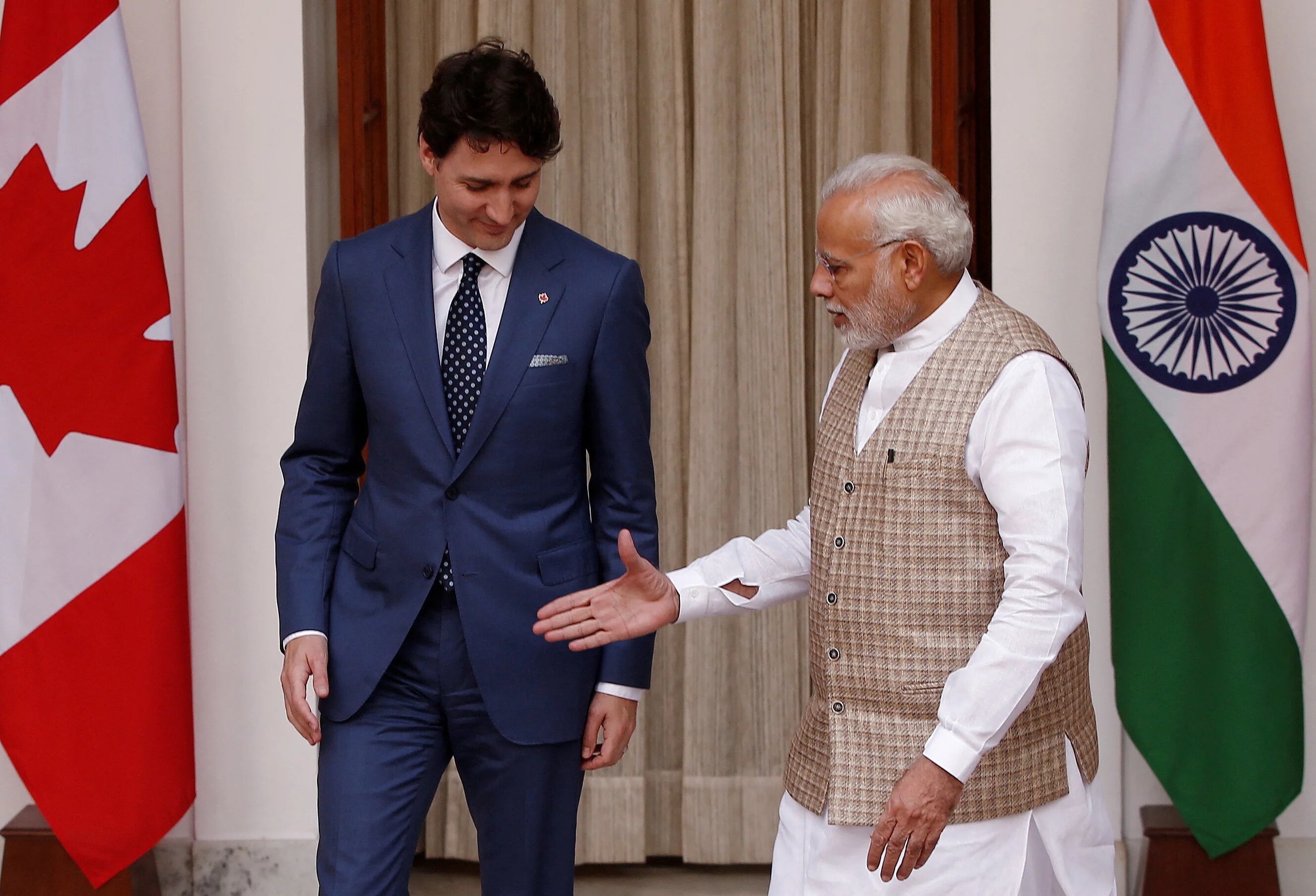 FILE PHOTO: Indian Prime Minister Narendra Modi (R) extends his hand for a handshake with his Canadian counterpart Justin Trudeau during a photo opportunity ahead of their meeting at Hyderabad House in New Delhi, India, February 23, 2018. REUTERS/Adnan Abidi/File Photo