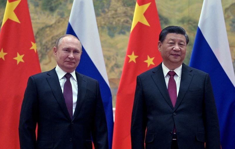 Foto de archivo del Presidente ruso Vladimir Putin junto a su par chino Xi Jinping en Pekín