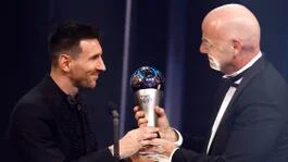 Soccer Football - The Best FIFA Football Awards - Salle Pleyel, Paris, France - February 27, 2023 Paris St Germain's Lionel Messi winner of The Best FIFA Player award 2022 receives the trophy from FIFA president Gianni Infantino REUTERS/Sarah Meyssonnier