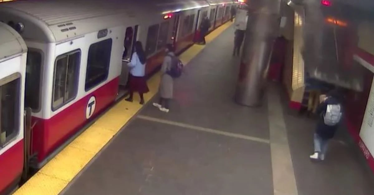 A passenger was saved from being injured after a sign fell at a Massachusetts train station