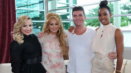 Con Demi Lovato, Paulina Rubio y Kelly Rowland, cuando fueron jurados de The X Factor