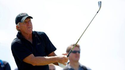 FILE PHOTO: Greg Norman of Australia watches his tee shot on the sixth hole during a practice round ahead of the British Open Golf Championship at the Turnberry Golf Club in Scotland, July 15, 2009.     REUTERS/Mike Blake/File Photo