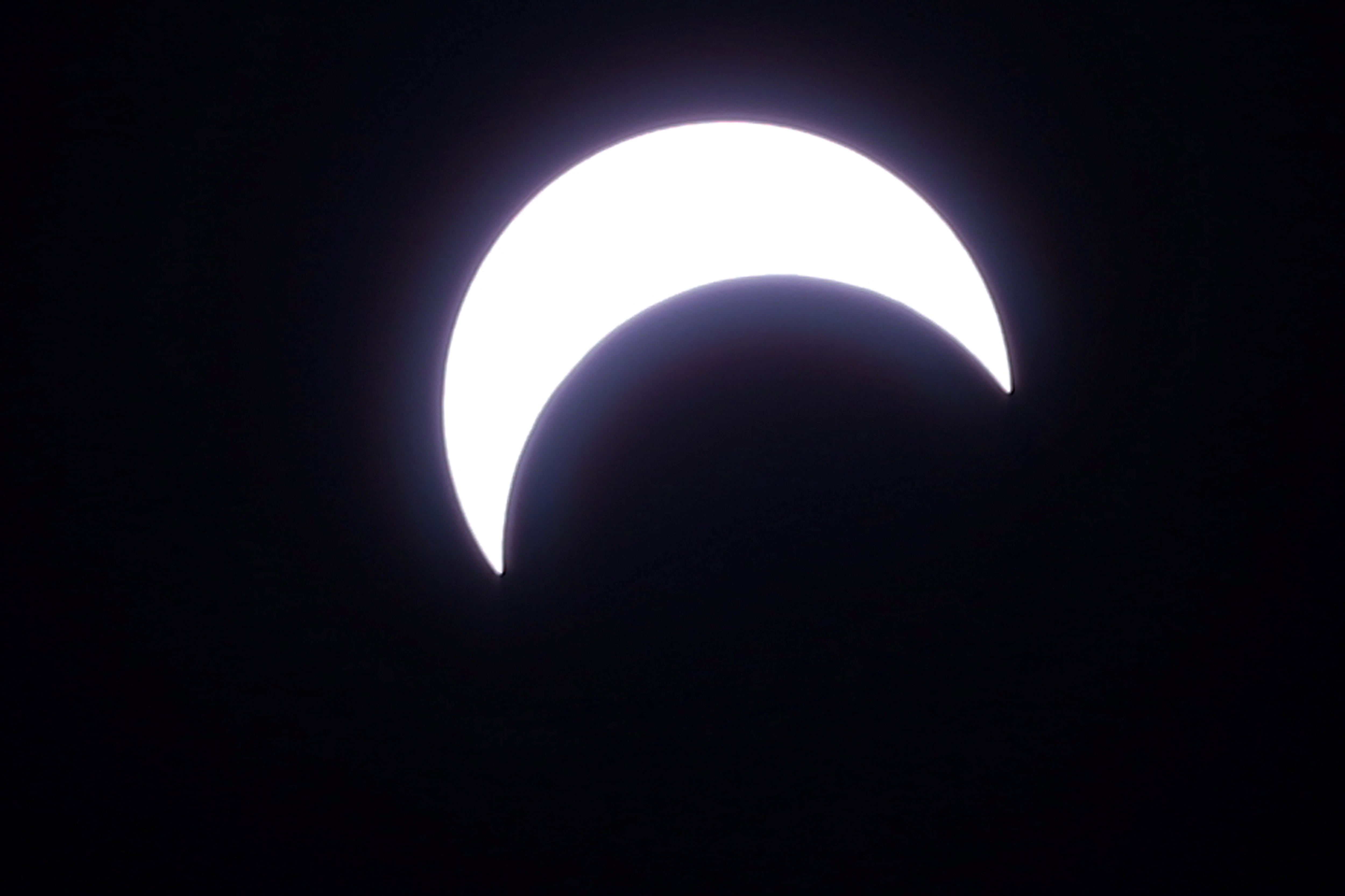 A photo shows a partial solar eclipse observed in Riyadh, Saudi Arabia June 21, 2020. REUTERS/Ahmed Yosri