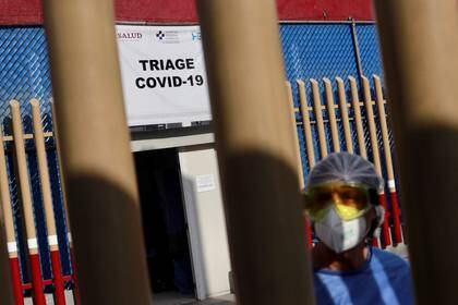A health workers stands by the entrance of the triage for patients with COVID-19 as the coronavirus disease (COVID 19) continues in Mexico City, Mexico May 4 2020. REUTERS/Carlos Jasso