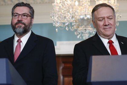 Secretary of State Mike Pompeo, right, and Brazilian Foreign Minister Ernesto Araujo, left, walk out to deliver remarks to members of the media at the Department of State in Washington, Friday, Sept. 13, 2019. (AP Photo/Pablo Martinez Monsivais)
