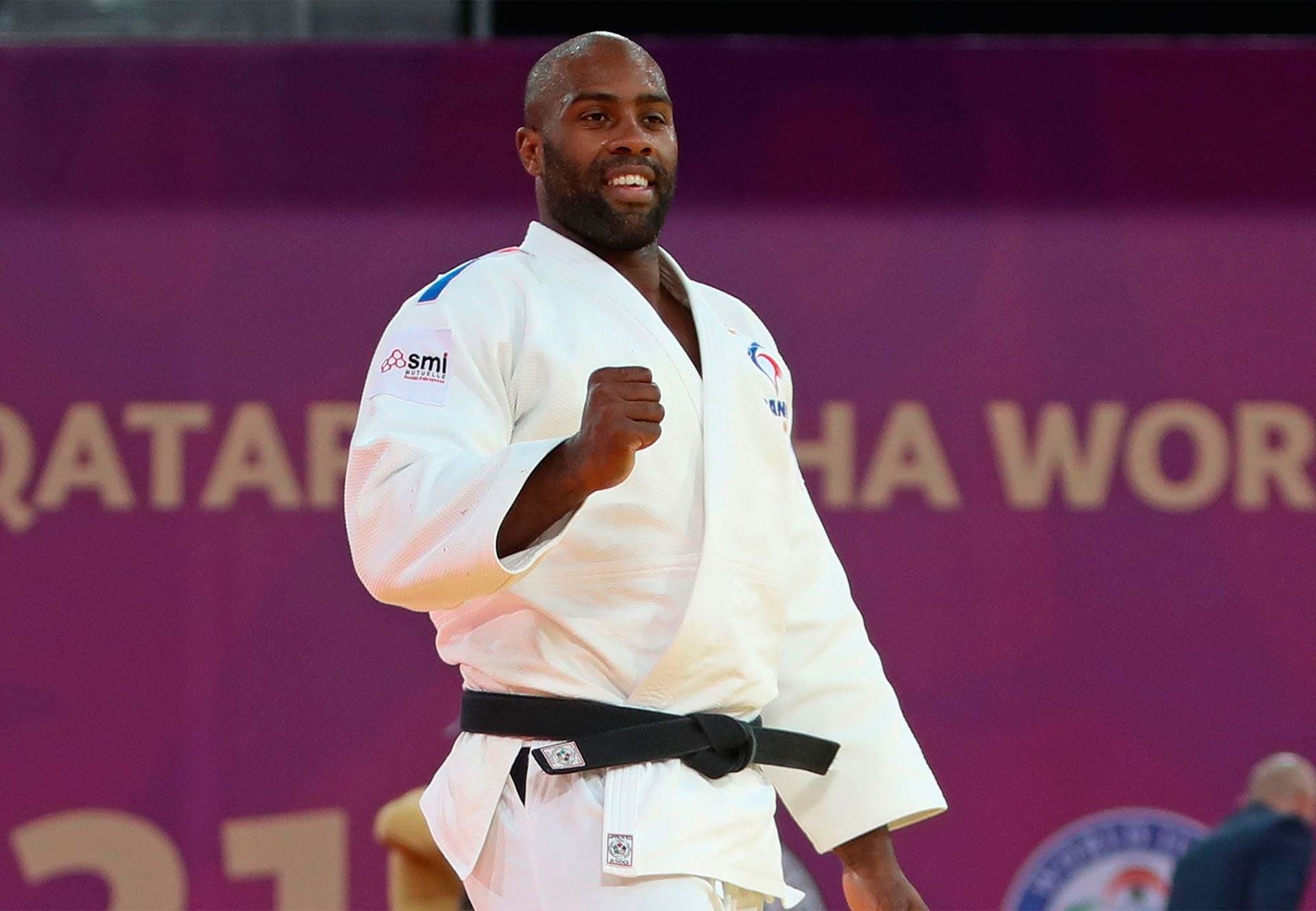 Tight fist for Teddy Riner after shouting world champion.