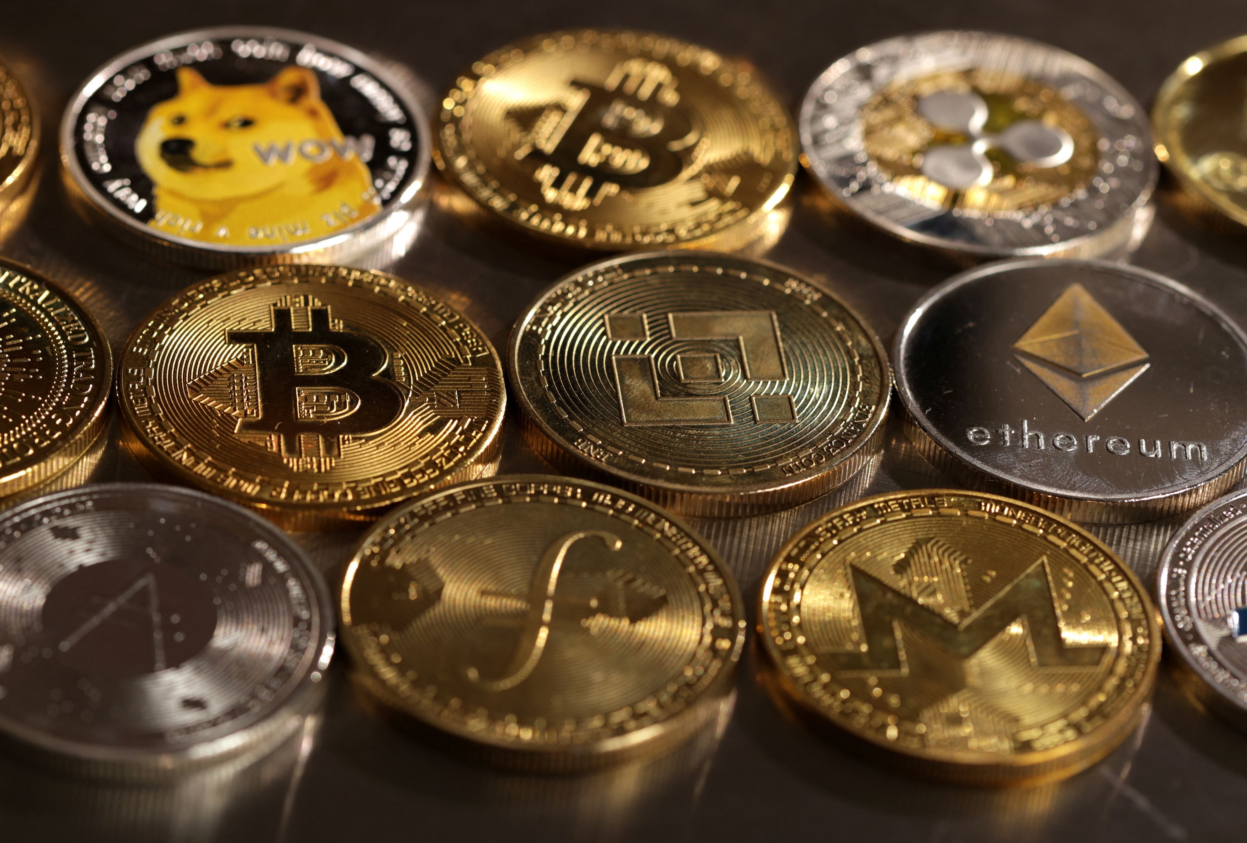 Representations of cryptocurrencies are seen in this illustration, August 10, 2022. REUTERS/Dado Ruvic/Illustration