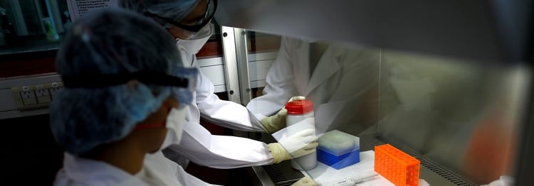 Laboratory technicians work with samples during a coronavirus analysis simulation at the Malbran institute in Buenos Aires, Argentina February 29, 2020. Picture taken February 29, 2020. REUTERS/Agustin Marcarian