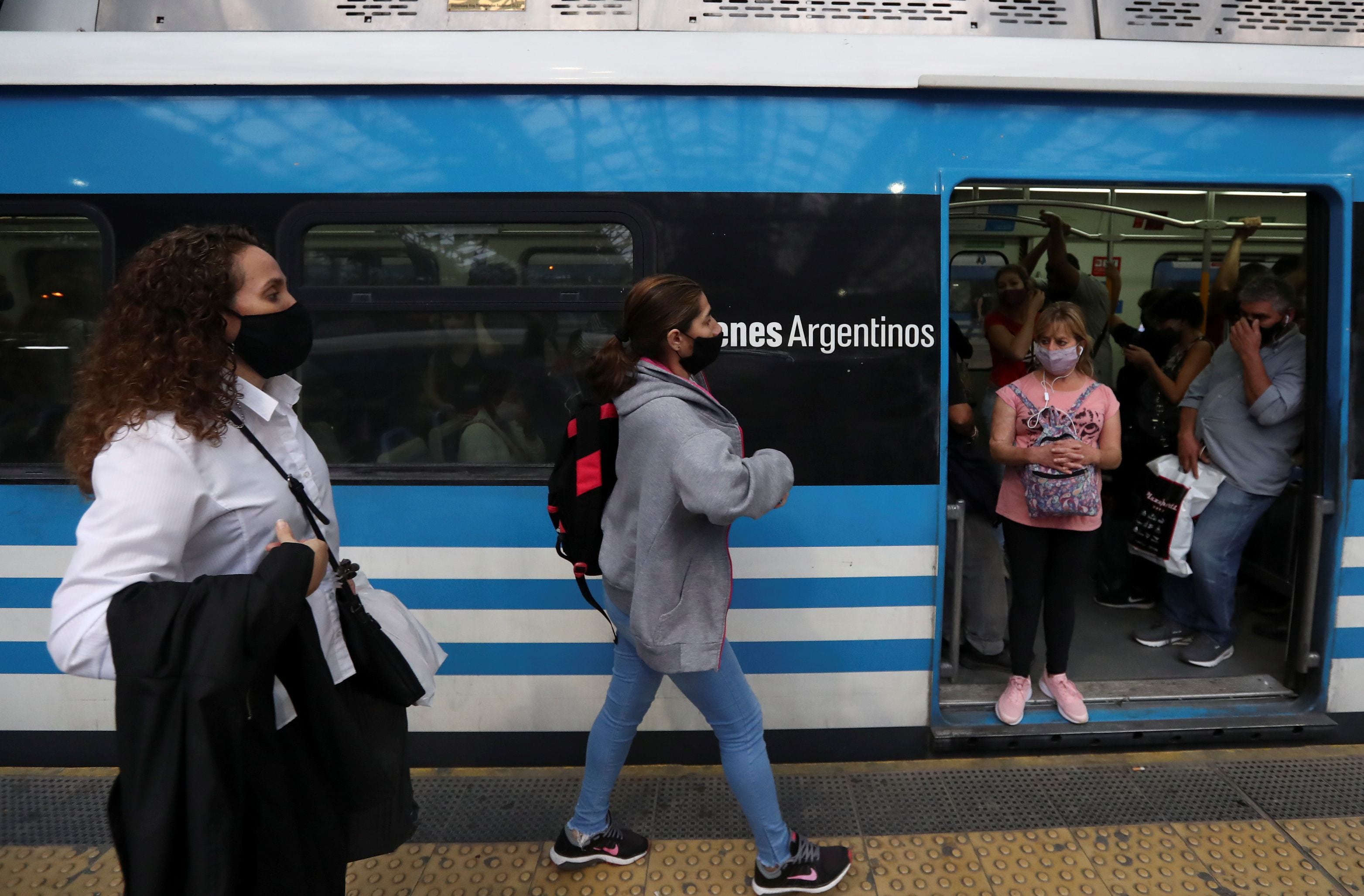 Passengers wearing face masks are seen inside a train at Constitucion train station, amid a rise in cases of the coronavirus disease (COVID-19), in Buenos Aires, Argentina April 8, 2021. REUTERS/Agustin Marcarian