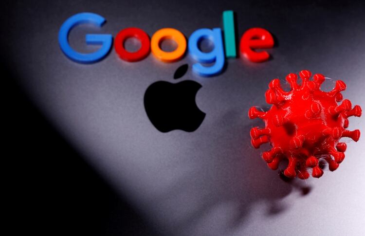 FILE PHOTO: 3D printed coronavirus model and Google logo are placed near an Apple Macbook Pro in this illustration taken April 12, 2020. REUTERS/Dado Ruvic/Illustration/File Photo