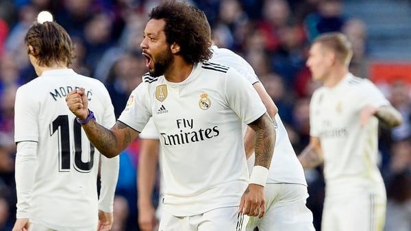 Real Madrid’s Brazilian defender Marcelo celebrates his goal during the Spanish league football match between FC Barcelona and Real Madrid CF at the Camp Nou stadium in Barcelona on October 28, 2018. (Photo by Josep LAGO / AFP)