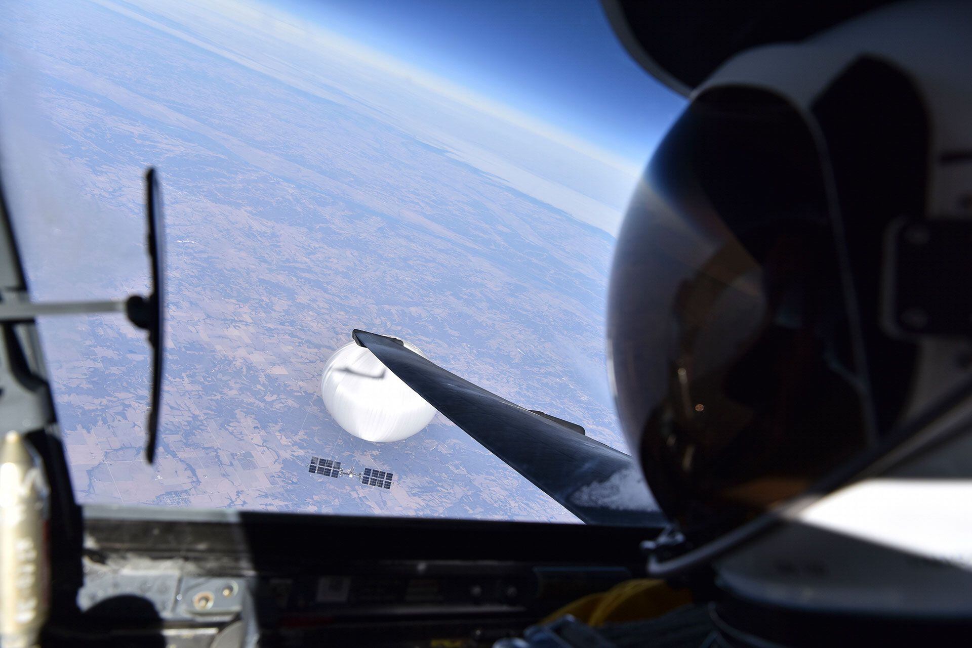In this image released by the Department of Defense on Wednesday, Feb. 22, 2023, a U.S. Air Force U-2 pilot looks down at a suspected Chinese surveillance balloon as it hovers over the United States on Feb. 3, 2023. (Department of Defense via AP)