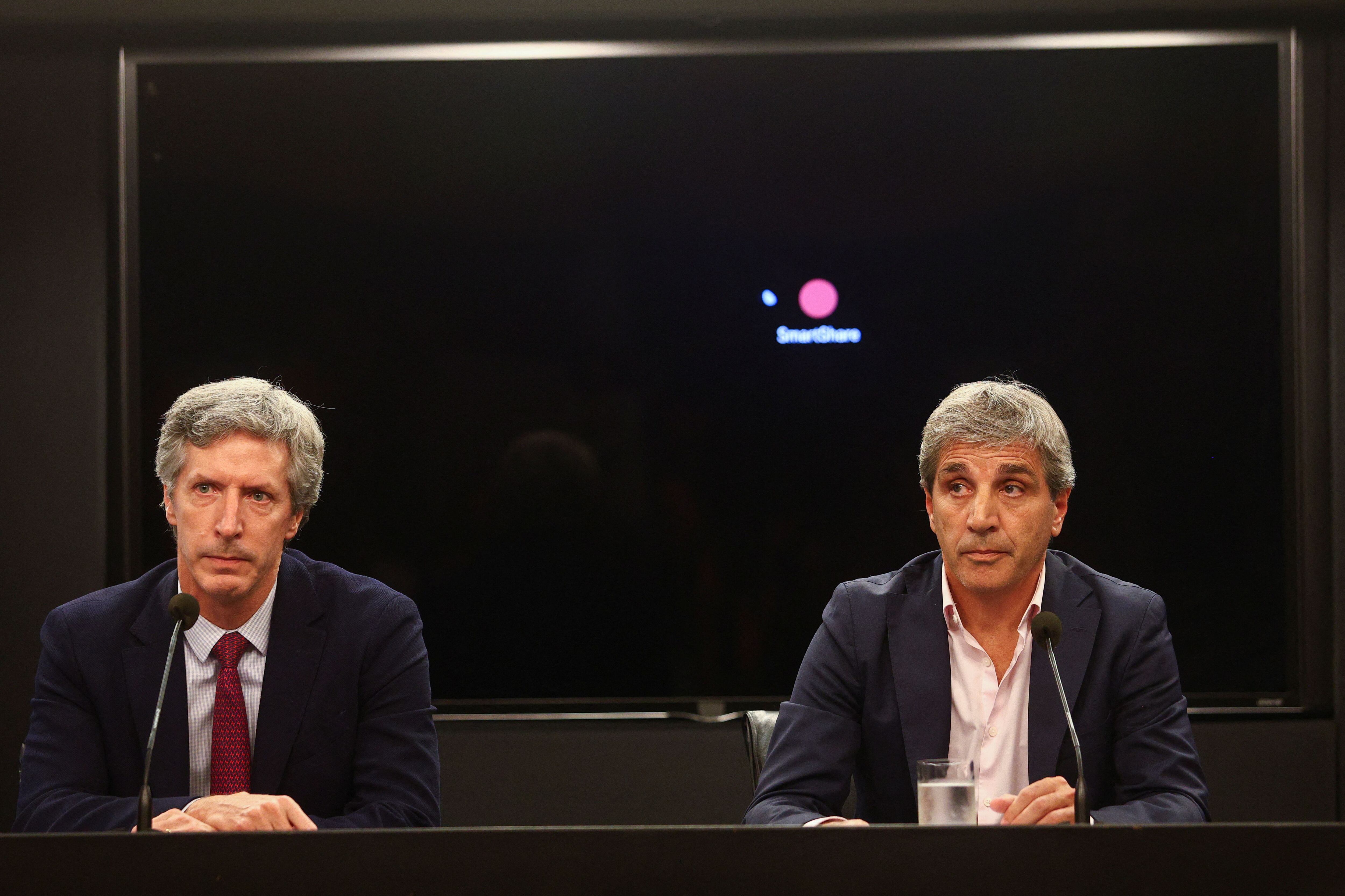 Argentina's Economy Minister Luis Caputo and Central Bank's President Santiago Bausili attend a press conference following a staff-level agreement with the International Monetary Fund (IMF) on the latest review of the country's $44 billion debt program, at the Economy Ministry building in Buenos Aires, Argentina, January 10, 2024. REUTERS/Matias Baglietto
