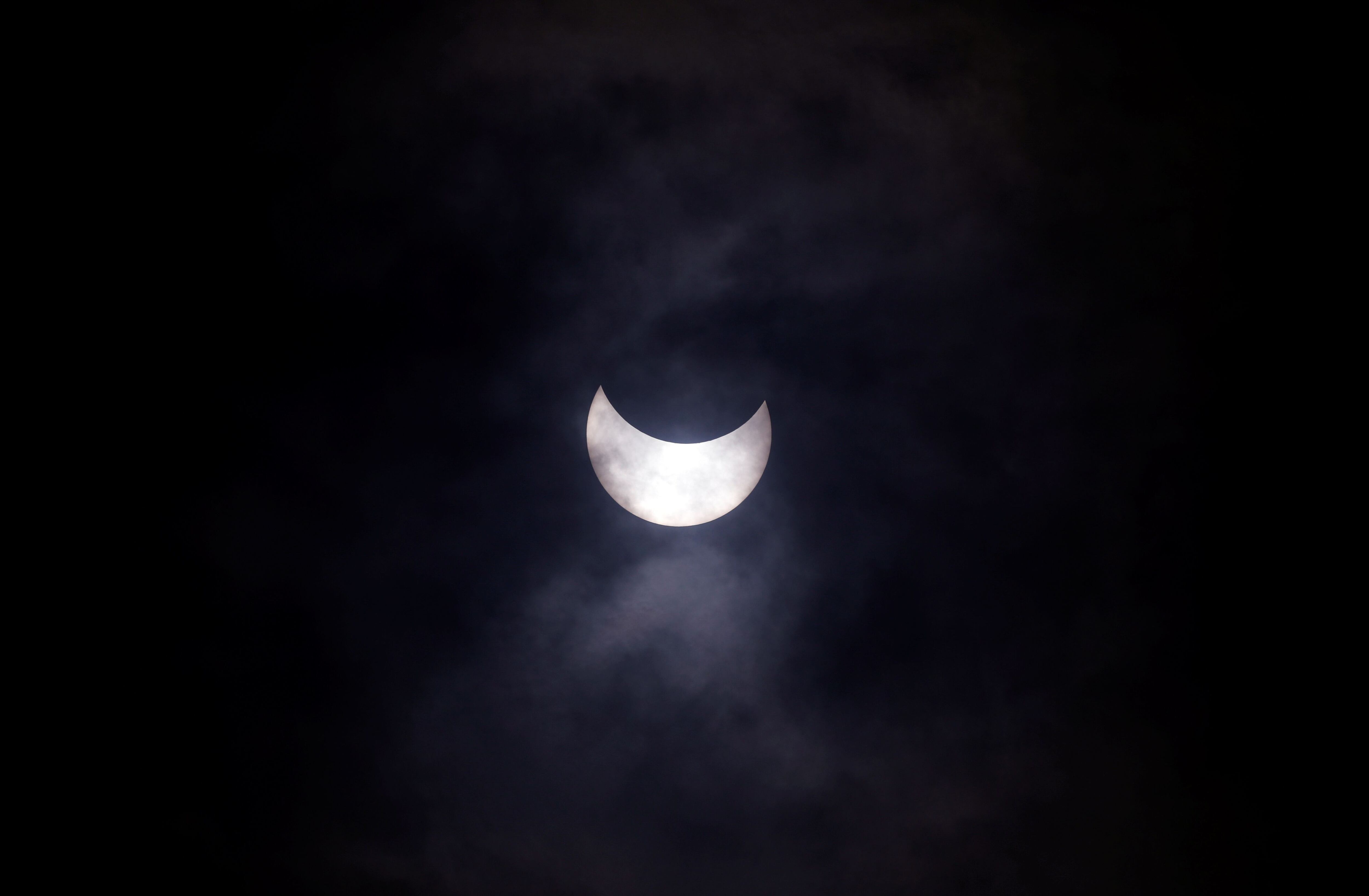 A partial solar eclipse is seen from Rajpath in New Delhi, India, June 21, 2020. REUTERS/Adnan Abidi