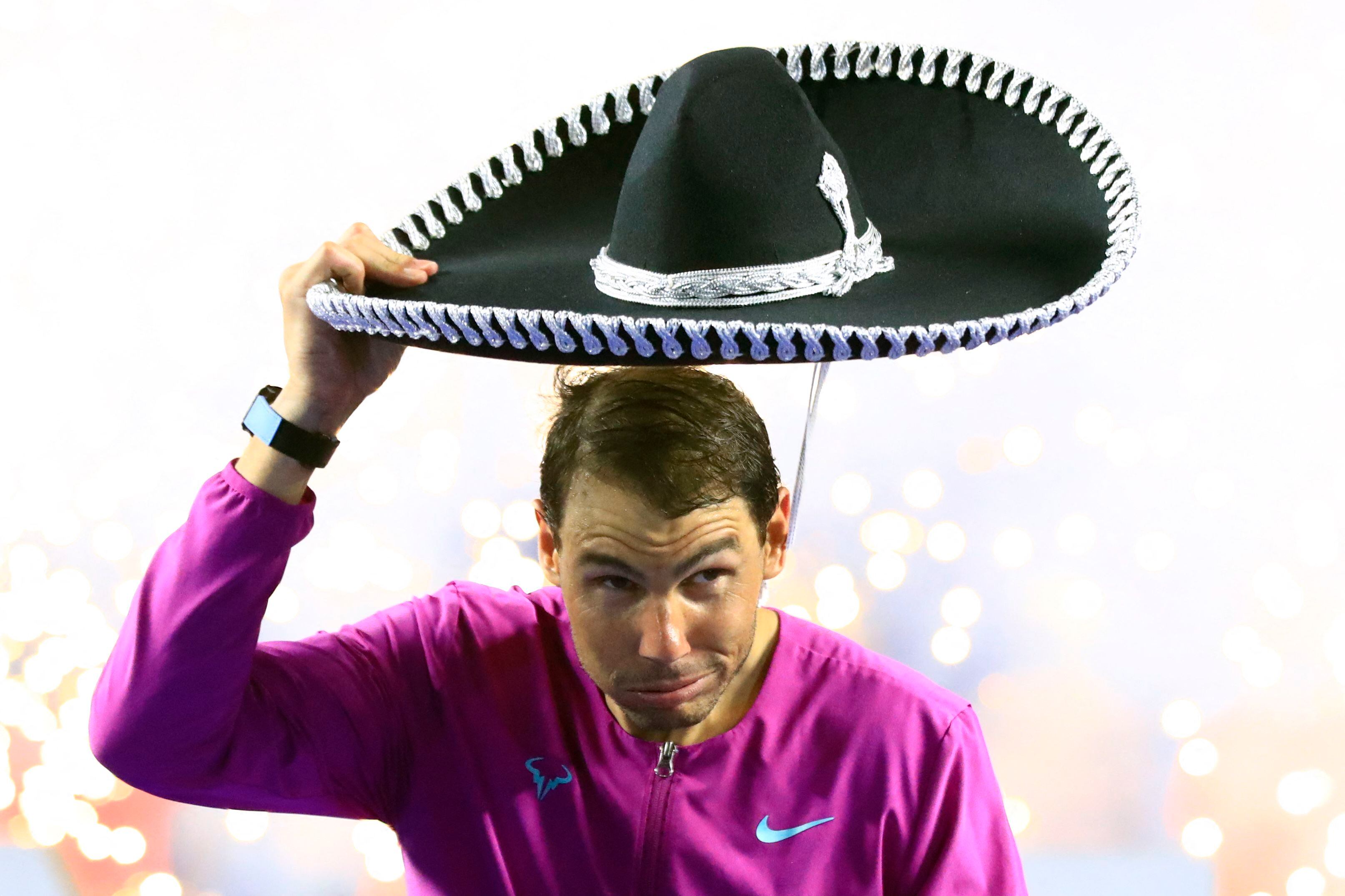 Tennis - ATP 500 - Abierto Mexicano - The Fairmont Acapulco Princess, Acapulco, Mexico - February 26, 2022 Spain's Rafael Nadal celebrates with a sombrero after winning the final REUTERS/Henry Romero