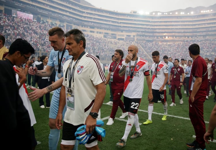 Soccer Football - Copa Libertadores - Final - Flamengo v River Plate - Monumental Stadium, Lima, Peru - November 23, 2019 River Plate's Javier Pinola looks dejected with team mates after losing the final REUTERS/Guadalupe Pardo