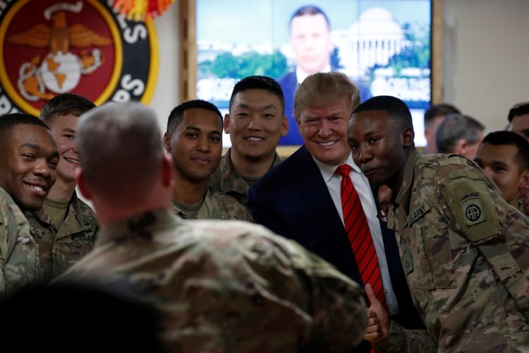 Donald Trump traveled by surprise to Afghanistan to share Thanksgiving dinner with US troops