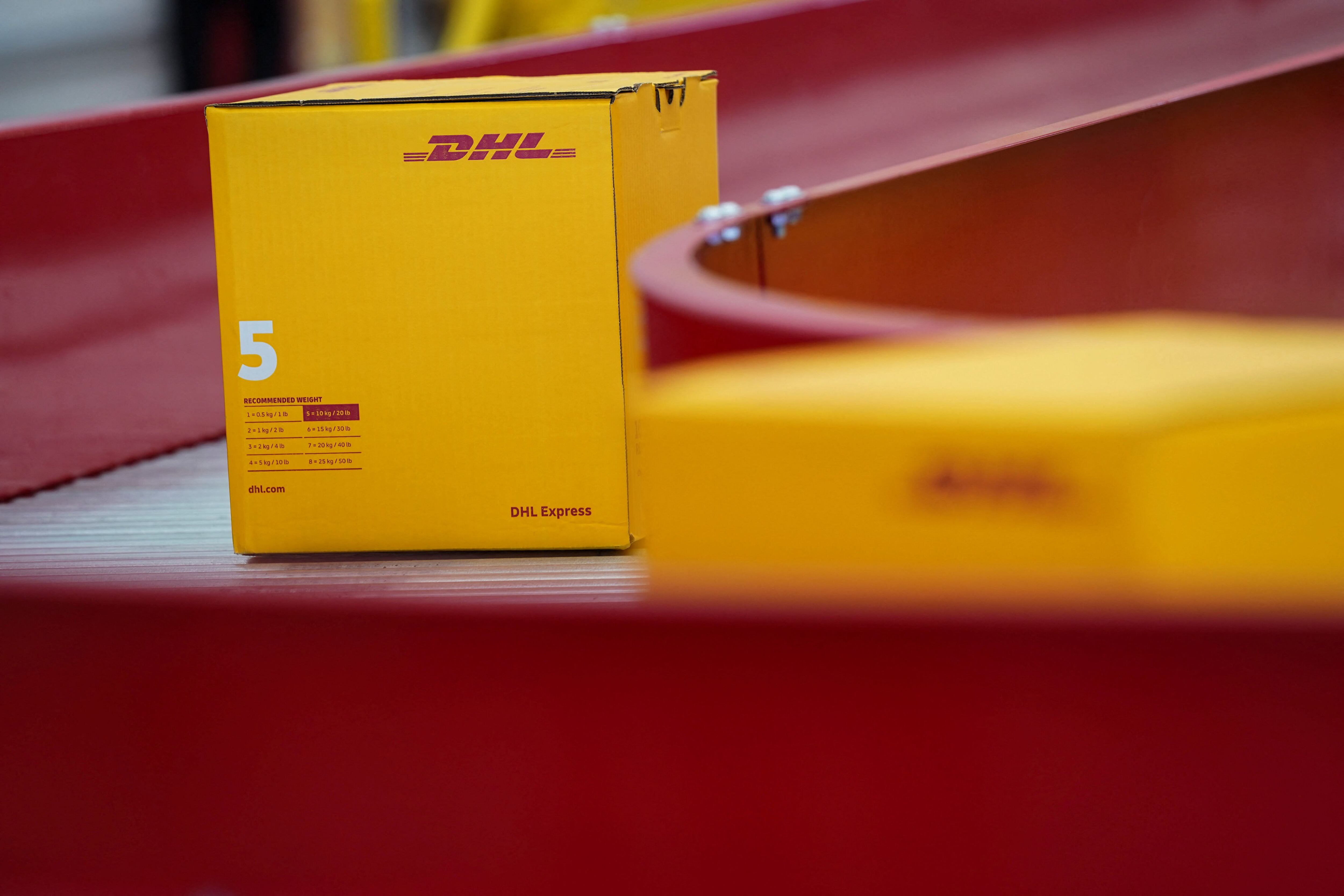 Boxes of German postal and logistics group Deutsche Post (DHL) are displayed during a demonstration marking the inauguration of the company’s new cargo facilities at the Felipe Angeles international airport in Zumpango, Mexico, February 28, 2023. REUTERS/Toya Sarno Jordan