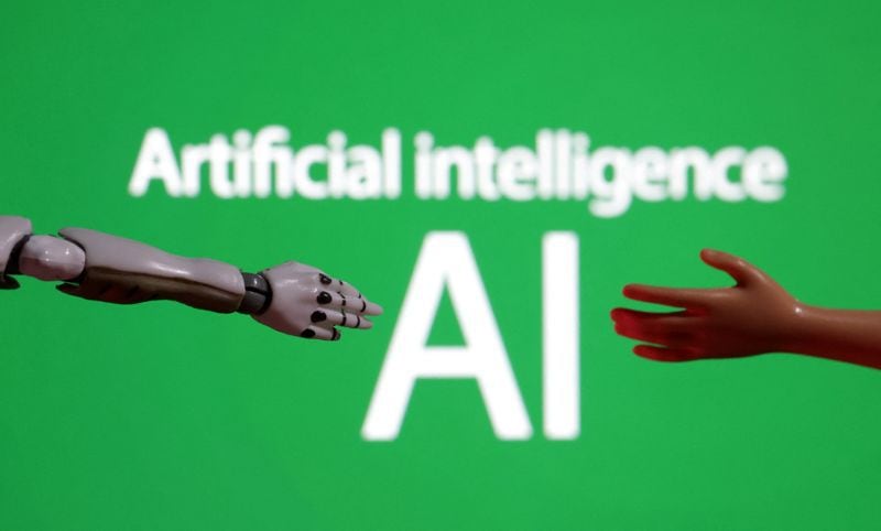 FOTO DE ARCHIVO: Las palabras "Inteligencia artificial AI", una miniatura de robot y una mano de juguete aparecen en esta ilustración tomada el 14 de diciembre de 2023. REUTERS/Dado Ruvic/Ilustración/Archivo