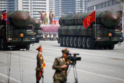 FILE PHOTO: Intercontinental ballistic missiles (ICBM) are driven past the stand with North Korean leader Kim Jong Un and other high ranking officials during a military parade marking the 105th birth anniversary of country's founding father Kim Il Sung, in Pyongyang April 15, 2017.  REUTERS/Damir Sagolj/File Photo