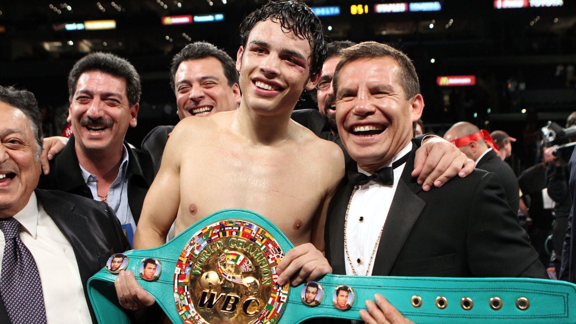 June 4, 2011, Los Angeles,Ca. ---  Julio Cesar Chavez Jr.(ctr)poses with his father legendary Julio Cesar Chavez (R)after defeatng Sebastian Zbik by 12-round majority decision to win the WBC World Middleweight title Saturday at Staples Center in Los Angeles.  --- Photo Credit : Chris Farina - Top Rank  (no other credit allowed)  copyright 2011