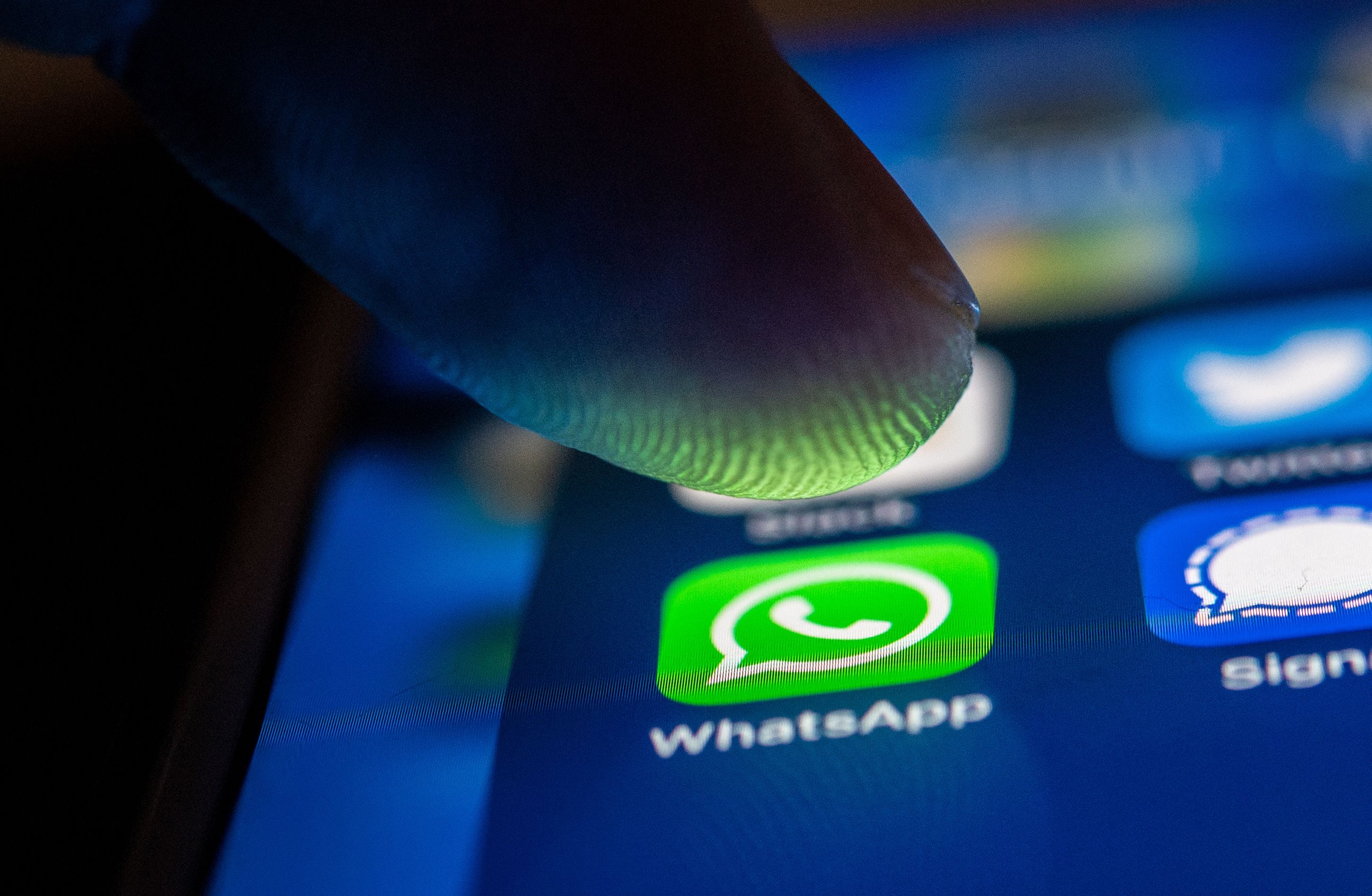 FILED - 19 January 2021, Berlin: A finger touches the Whatsapp logo on a smartphone. Photo: Zacharie Scheurer/dpa