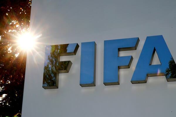 FILE PHOTO: The logo of FIFA is seen in front of its headquarters in Zurich, Switzerland September 26, 2017. REUTERS/Arnd Wiegmann/File Photo