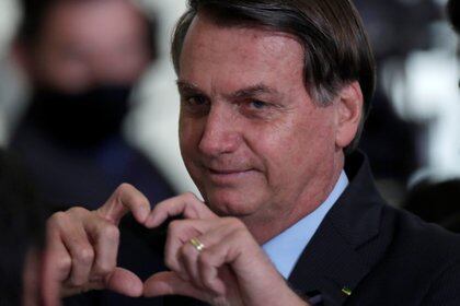 Brazil's President Jair Bolsonaro gestures after attending the launching ceremony of the New Credit of the Housing by settlers at the Planalto Palace in Brasilia, Brazil, September 30, 2020. REUTERS/Ueslei Marcelino