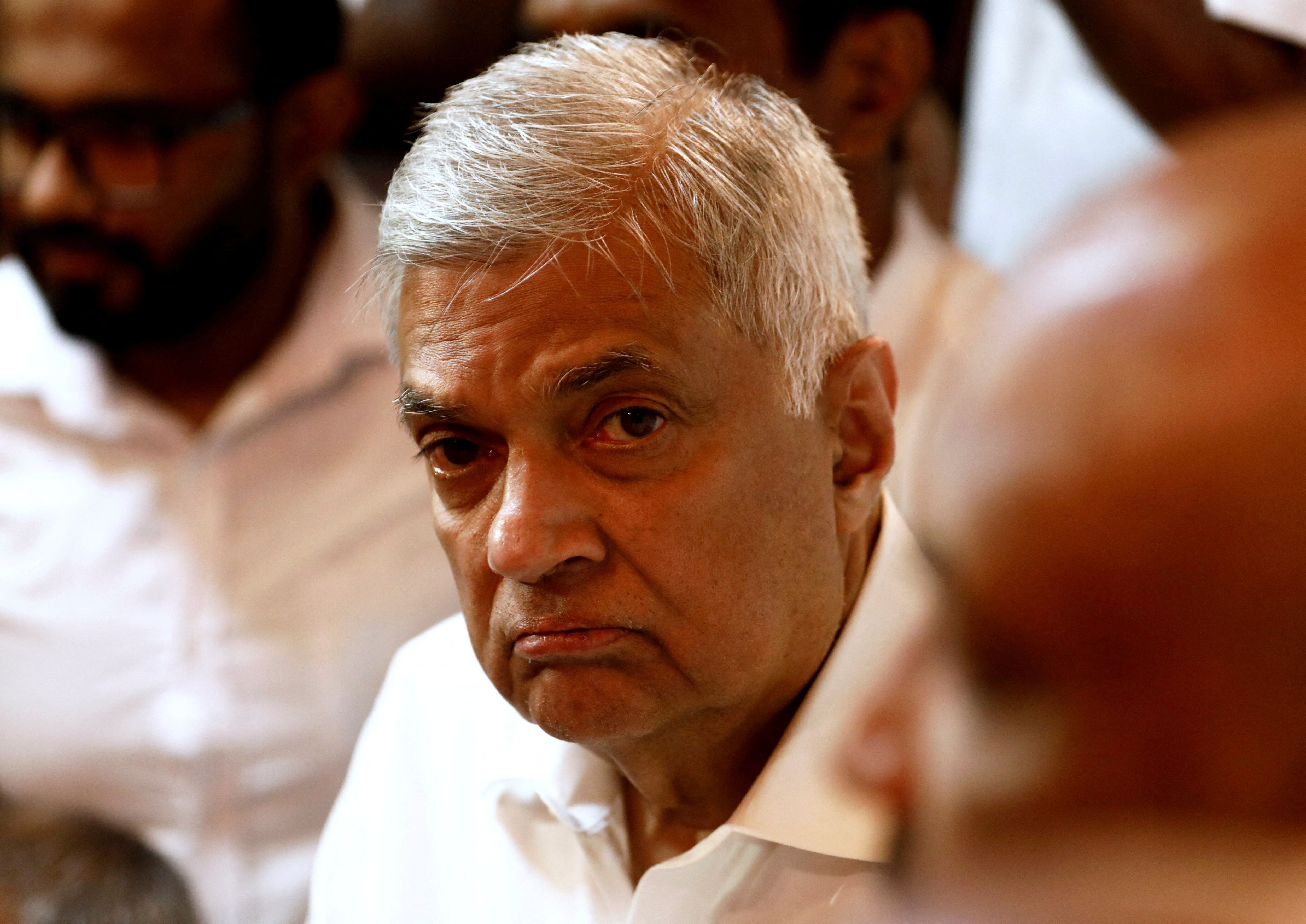 FILE PHOTO: Sri Lankan Prime Minister Ranil Wickremesinghe arrives at a Buddhist temple after his swearing-in ceremony amid the country's economic crisis, in Colombo, Sri Lanka, May 12, 2022. REUTERS/Dinuka Liyanawatte/File Photo/File Photo