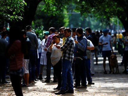 People gather on the street after an earthquake in Mexico City, Mexico June 23, 2020. REUTERS/Claudia Daut