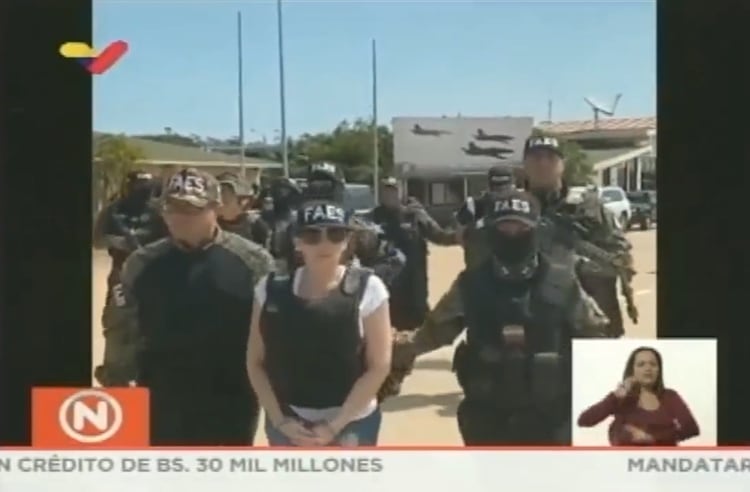 Aida Merlano escoltada por las fuerzas de seguridad venezolanas