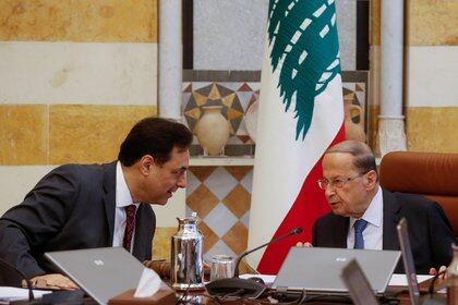 Diab speaks with the President of Lebanon Michel Aoun during a cabinet meeting at the presidential palace in ba'abda, Lebanon, on February 6, 2020.