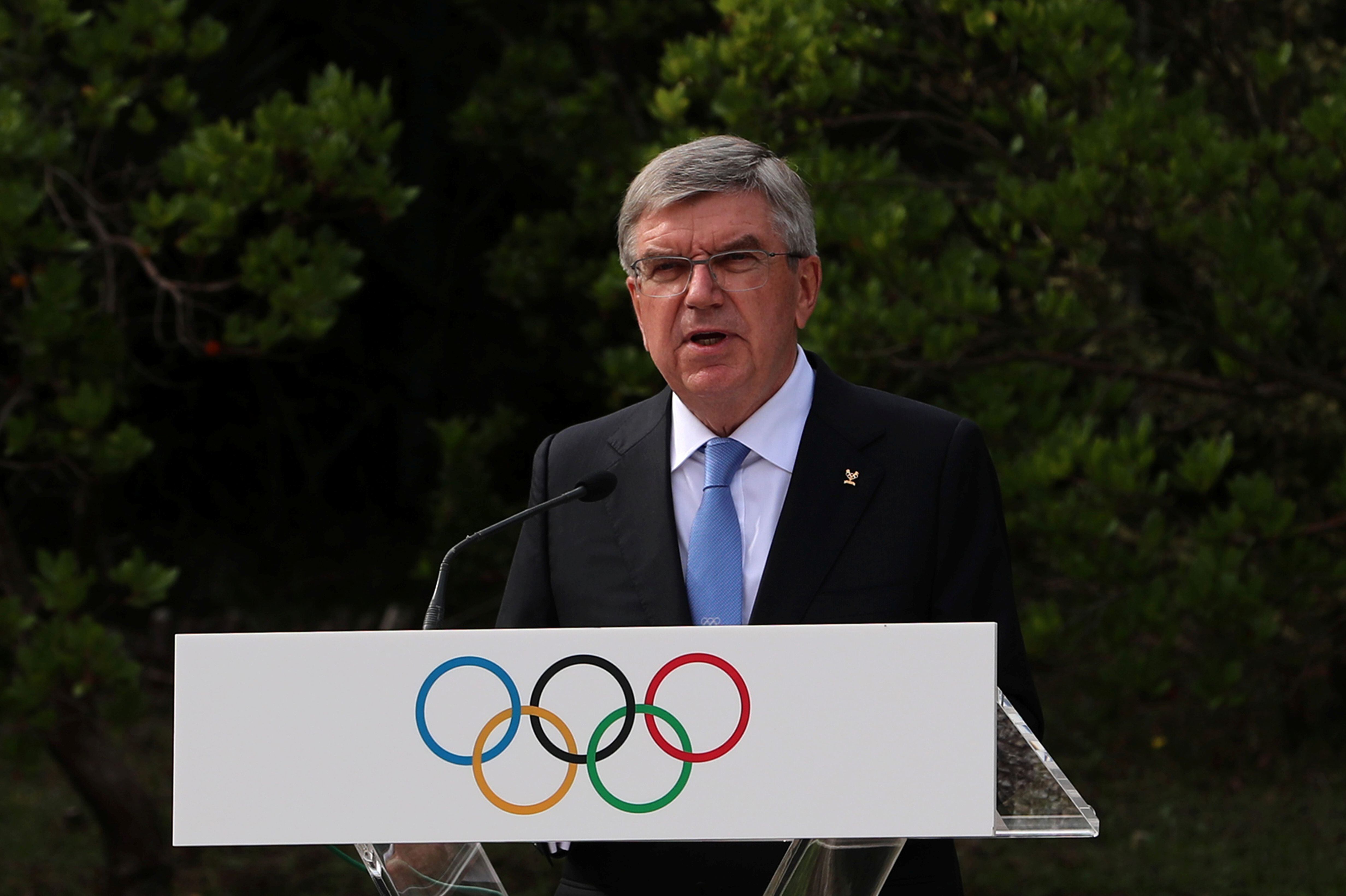 President of the International Olympic Committee (IOC) Thomas Bach delivers a speech at the Pierre de Coubertin monument, where the founder of the IOC's heart is buried, during a ceremony for the 100-year anniversary of the creation of the IOC Executive Board, in Ancient Olympia, Greece, October 17, 2021. REUTERS/Costas Baltas