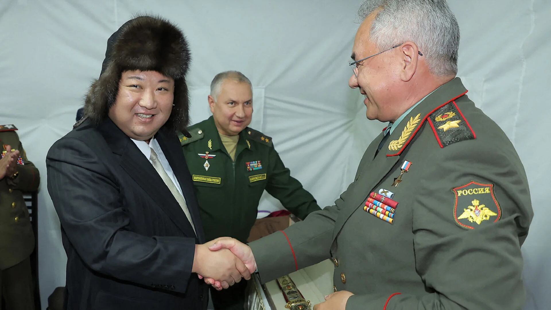 This picture taken on September 16, 2023 and released from North Korea's official Korean Central News Agency (KCNA) on September 17, 2023 shows North Korea's leader Kim Jong Un (L) shaking hands with Russia's Defence Minister Sergei Shoigu (R) after receiving a gift at their luncheon during a visit to the port in Vladivostok, Primorsky region. North Korean leader Kim Jong Un met on September 16 with the Russian defence minister in Vladivostok, where he inspected state-of-the-art weapons including a hypersonic missile system on the latest leg of a rare visit outside his country. (Photo by KCNA VIA KNS / AFP) / South Korea OUT / REPUBLIC OF KOREA OUT
---EDITORS NOTE--- RESTRICTED TO EDITORIAL USE - MANDATORY CREDIT "AFP PHOTO/KCNA VIA KNS" - NO MARKETING NO ADVERTISING CAMPAIGNS - DISTRIBUTED AS A SERVICE TO CLIENTS / THIS PICTURE WAS MADE AVAILABLE BY A THIRD PARTY. AFP CAN NOT INDEPENDENTLY VERIFY THE AUTHENTICITY, LOCATION, DATE AND CONTENT OF THIS IMAGE --- / 