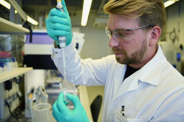 Employee Philipp Hoffmann, of German biopharmaceutical company CureVac, demonstrates research workflow on a vaccine for the coronavirus (COVID-19) disease at a laboratory in Tuebingen, Germany, March 12, 2020. Picture taken on March 12, 2020. REUTERS/Andreas Gebert