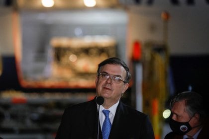 Mexico's Foreign Minister Marcelo Ebrard speaks during the arrival of the first batch of Russia's Sputnik V coronavirus disease (COVID-19) vaccine at the Benito Juarez International airport, as the coronavirus disease (COVID-19) outbreak continues, in Mexico City, Mexico February 22, 2021. REUTERS/Carlos Jasso
