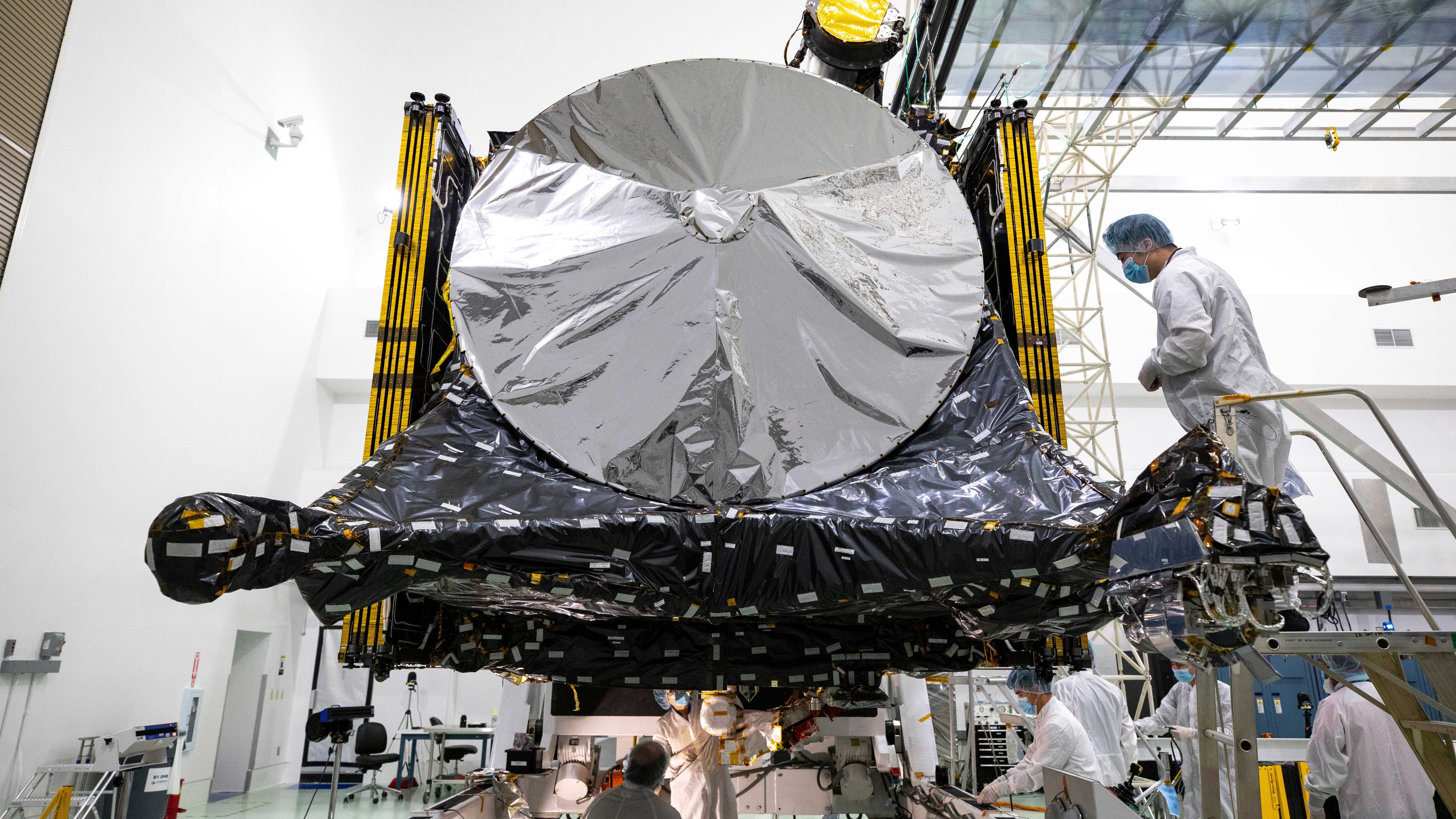 A photo from late July provided by NASA shows members of the Psyche mission team preparing the spacecraft at a facility near NASA's Kennedy Space Center in Florida.  (EFE/Kim Shiflett/NASA)