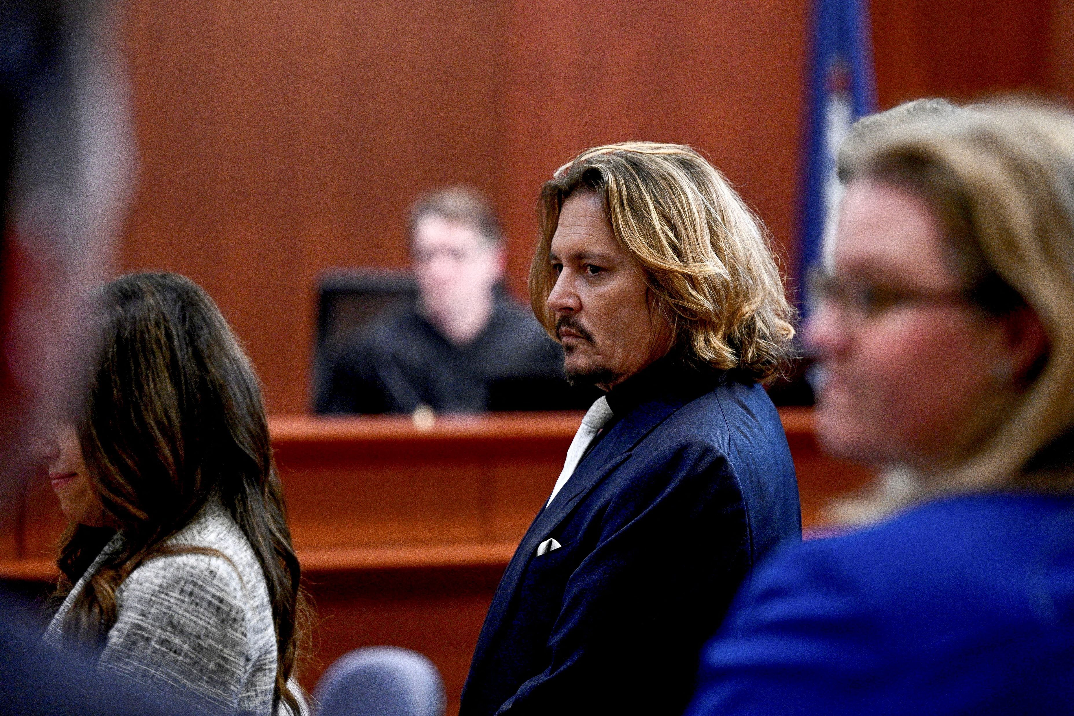 Actor Johnny Depp sits in the courtroom during his defamation case against Amber Heard at Fairfax County Circuit Court, Virginia, U.S., April 12, 2022. Brendan Smialowski/Pool via REUTERS