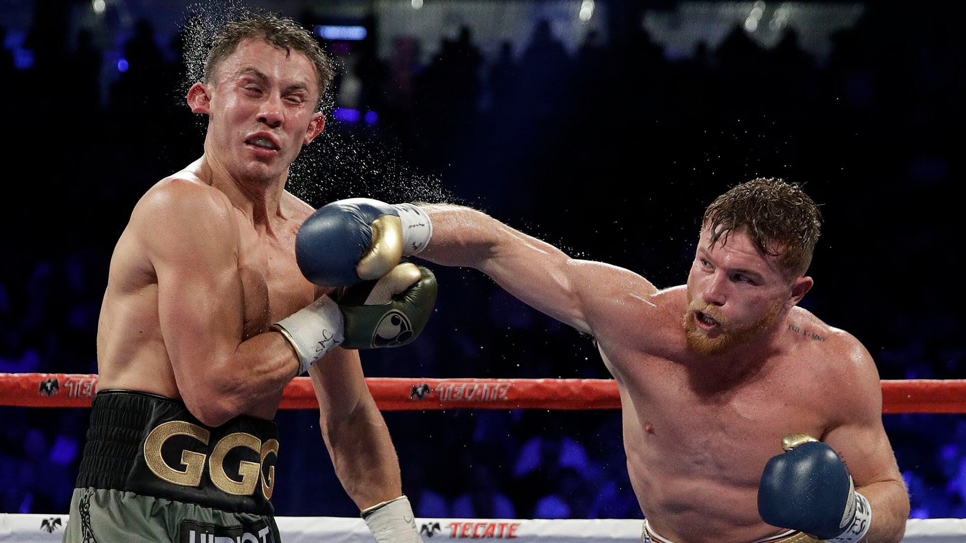 Canelo Alvarez, right, connects with a right to Gennady Golovkin during a middleweight title fight Saturday, Sept. 16, 2017, in Las Vegas. (AP Photo/John Locher)